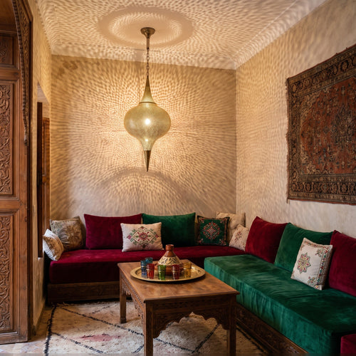 Aksil pendant lit beneath the arches of a Moroccan riad