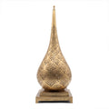 Anbar tall pierced brass table lamp on a seamless white studio background