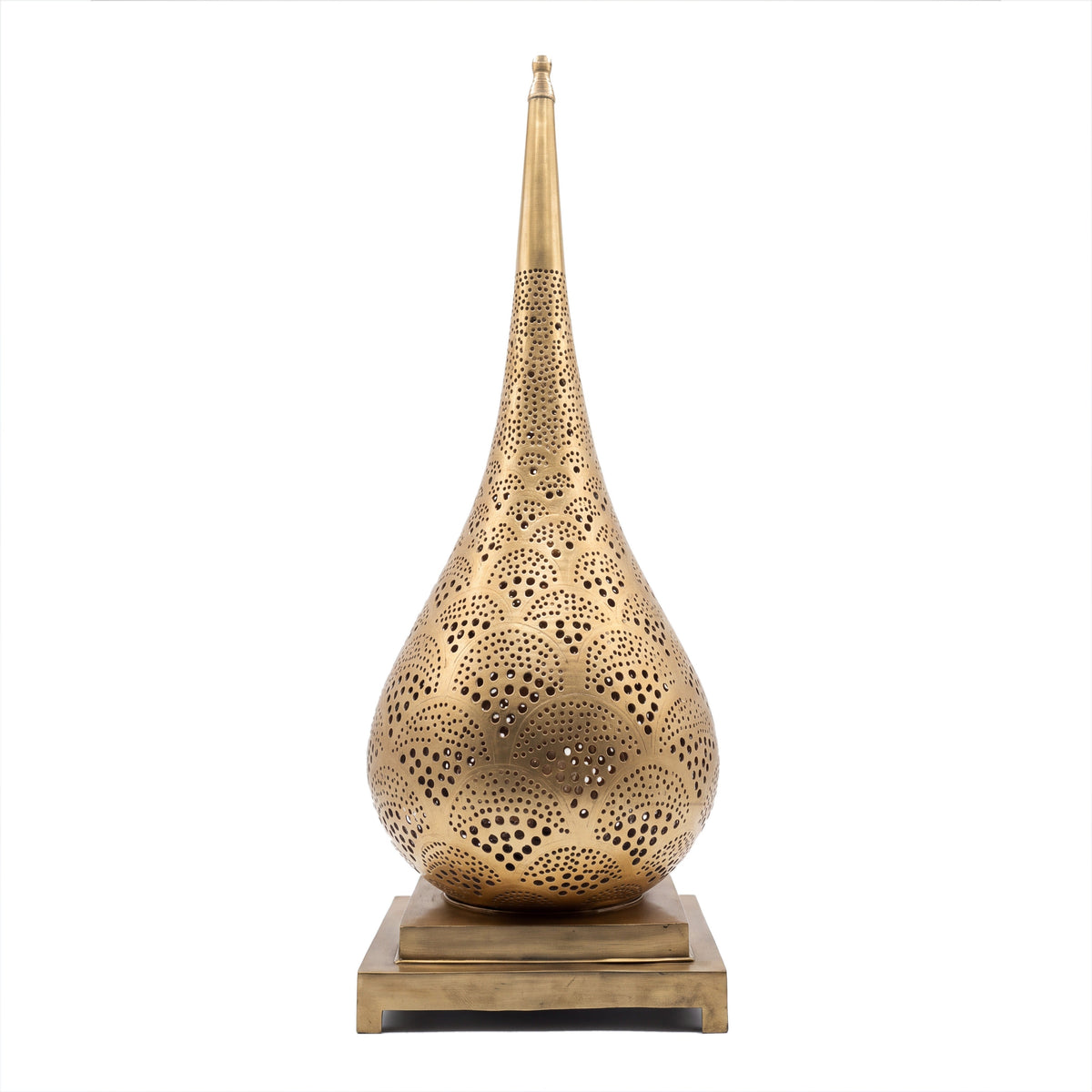 Anbar tall pierced brass table lamp on a seamless white studio background