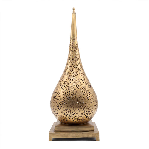 Anbar tall pierced brass table lamp on a seamless white studio background