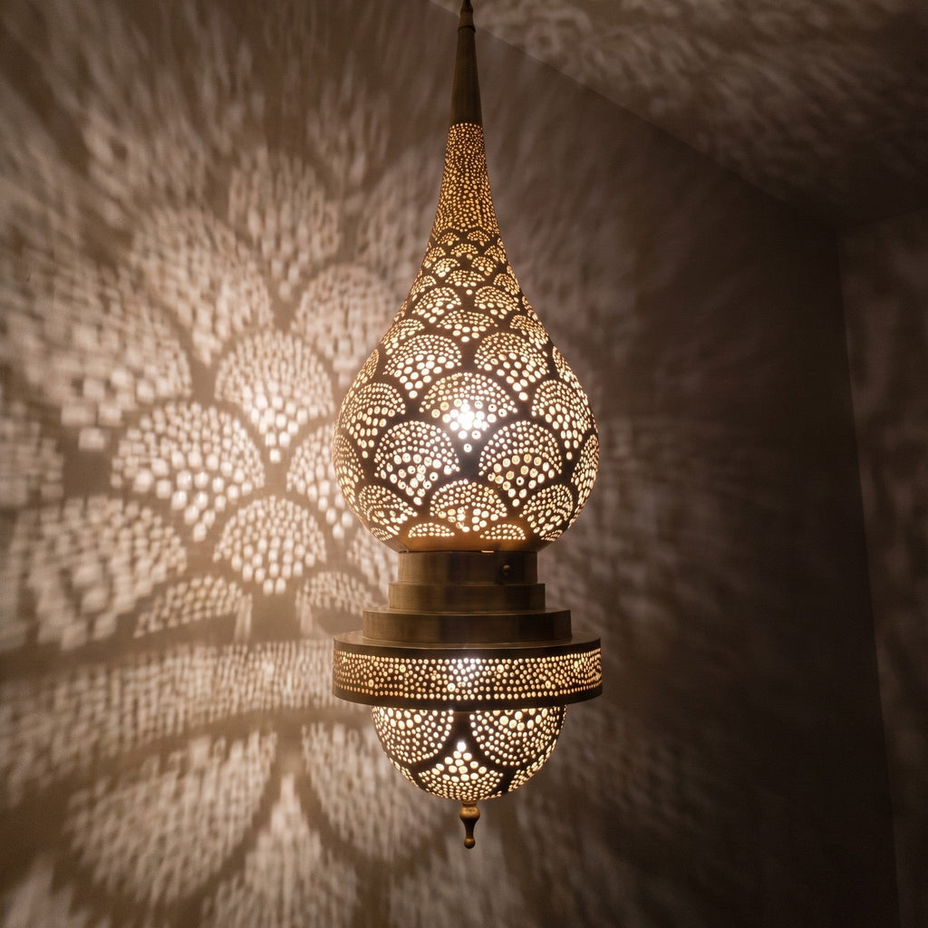 Close view of the lit Asafu, pattern glowing through pierced brass