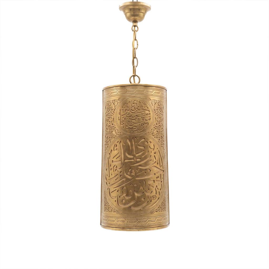 Aya calligraphy sconce in brass on a white studio background