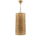 Aya calligraphy sconce in brass on a white studio background