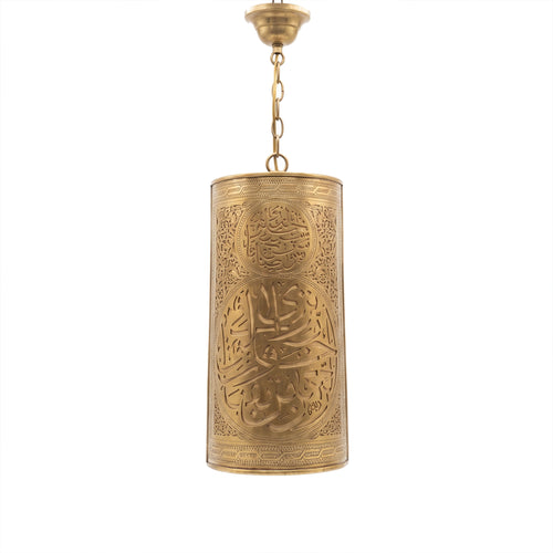 Aya calligraphy sconce in brass on a white studio background