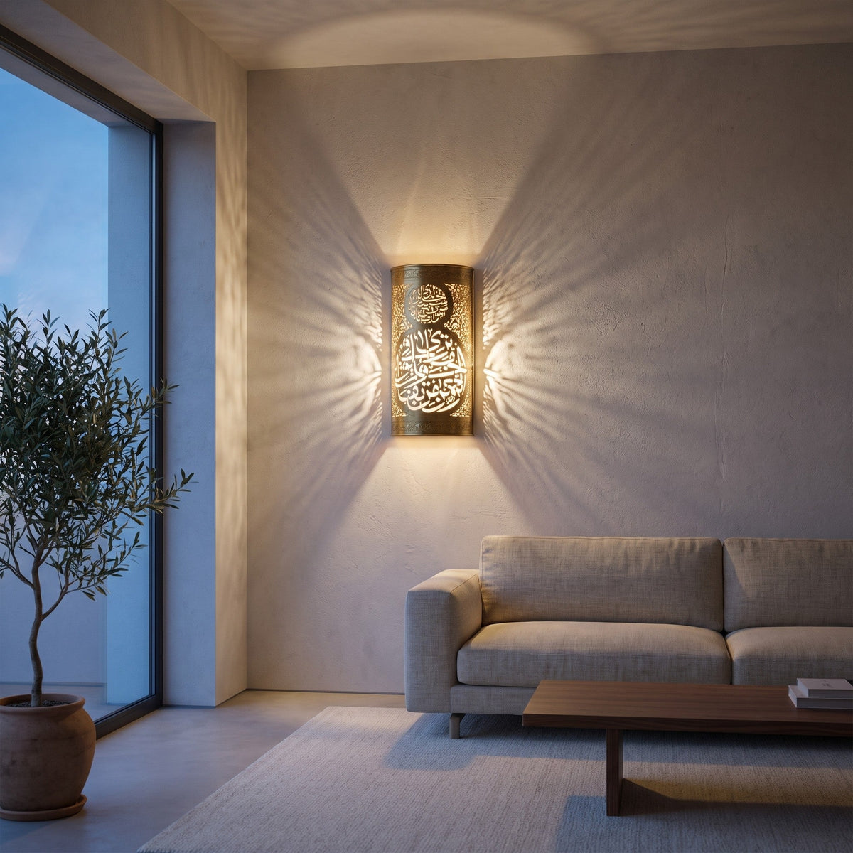 Aya brass sconce with pierced Arabic calligraphy on a modern living room wall