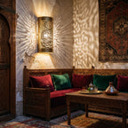 Aya calligraphy sconce lighting a quiet corner of a Moroccan riad