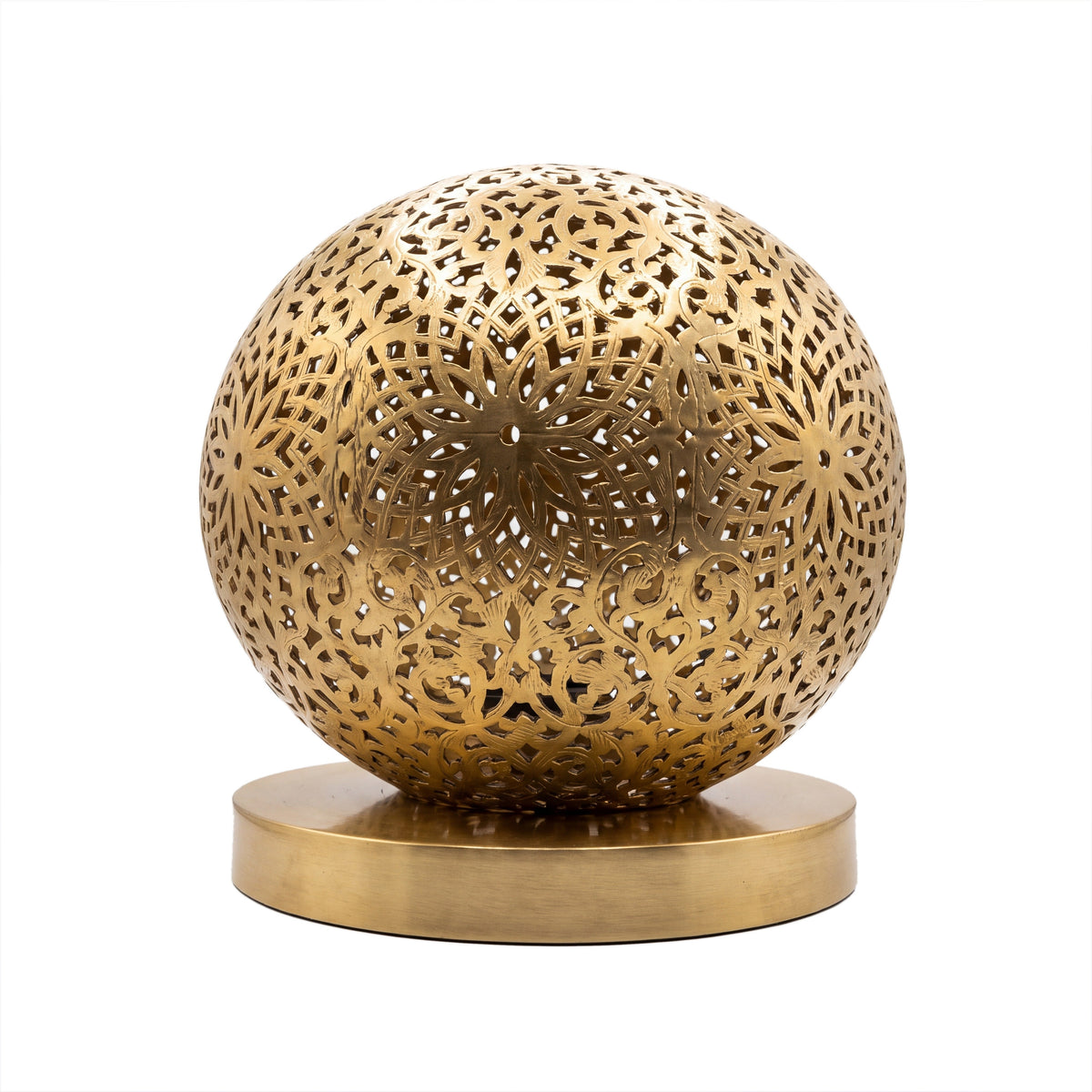 Ayyur engraved and pierced brass ball table lamp on a white studio background