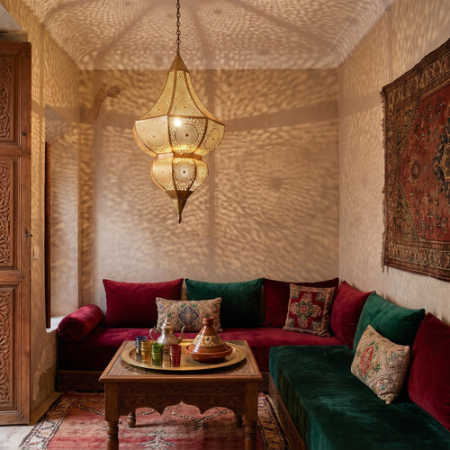 Badi pendant lit under the arcades of a Moroccan riad