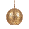 Baraka dome pendant of punched brass circles on a white studio background