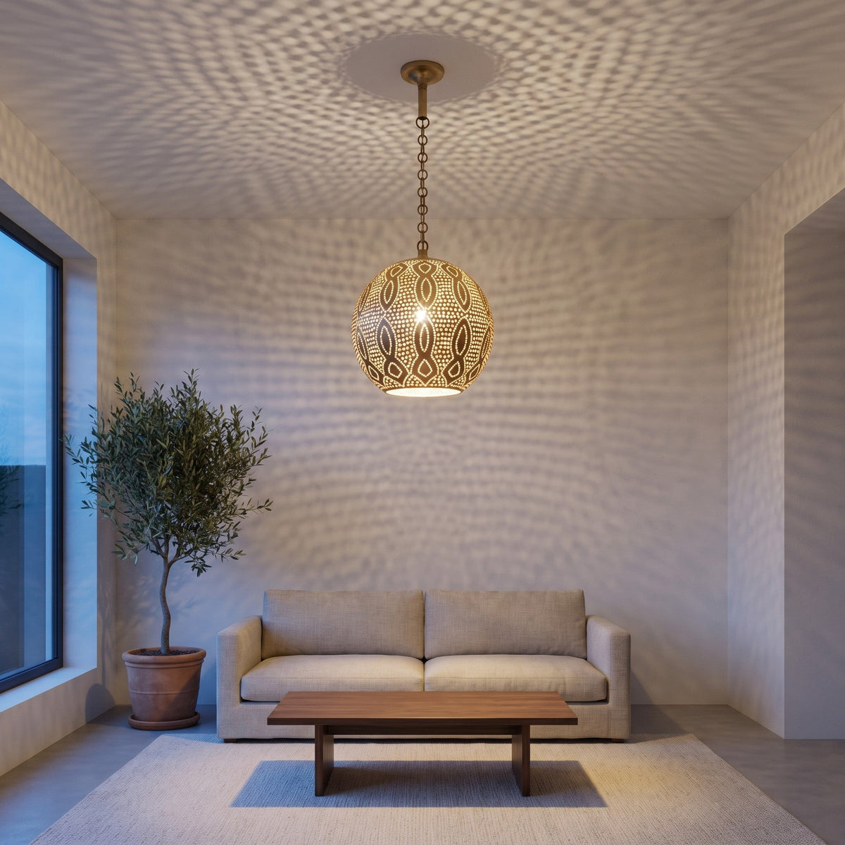 Baraka brass dome pendant over a kitchen counter in a modern home