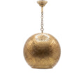 Chourouk pendant, an open punched brass ball, on a white studio background