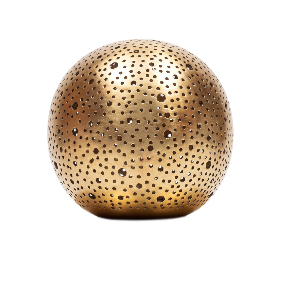 Daya pierced brass ball table lamp on a white studio background