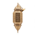 Fajr sconce, a tall pierced brass wall light on a white studio background
