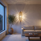 Fajr brass sconce lit beside a doorway in a modern hallway