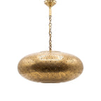 Gnawa pierced brass pendant with music note cutouts on a white studio background