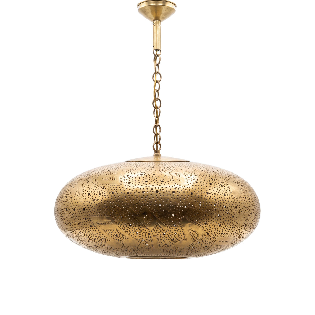 Gnawa pierced brass pendant with music note cutouts on a white studio background