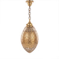 Kenza pendant, an engraved brass egg with antique patina, on a white studio background