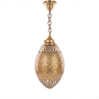 Kenza pendant, an engraved brass egg with antique patina, on a white studio background