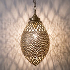 Detail of the lit Kenza pendant, engraving and pierced holes glowing