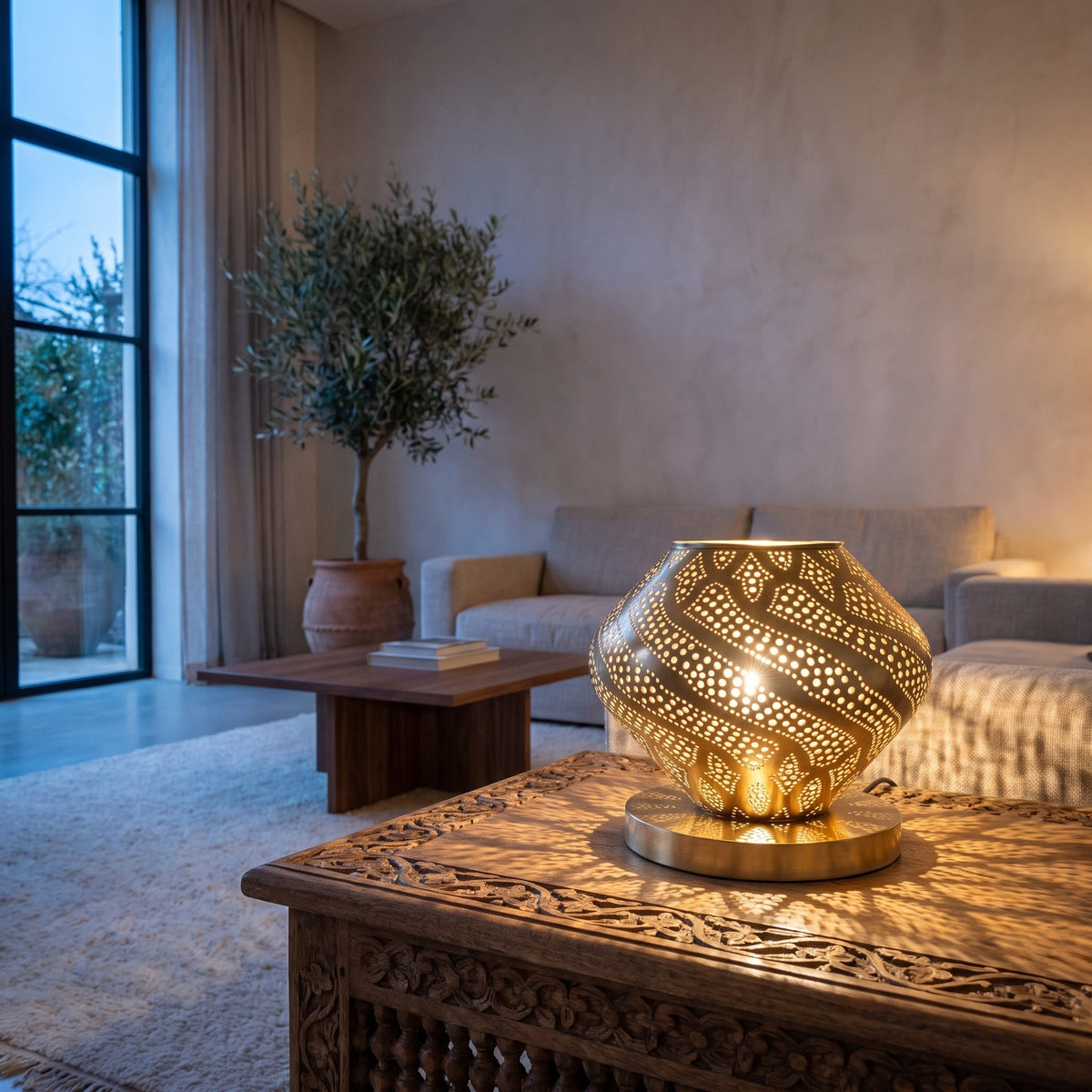 Khzama lantern lit on a sideboard in a modern interior, light through open petals