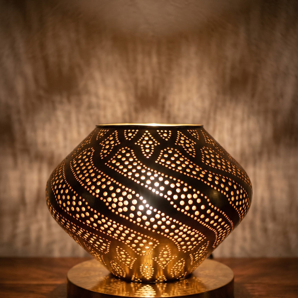 Detail of Khzama lit, pierced brass petals glowing from within