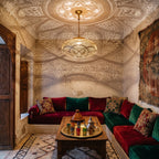 Layla pendant casting its lattice of light on riad walls after dark