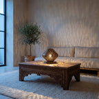 Louiza lantern lit on a windowsill in a modern living room