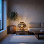 Louz lantern lit on a coffee table in a modern living room, pattern on the tabletop