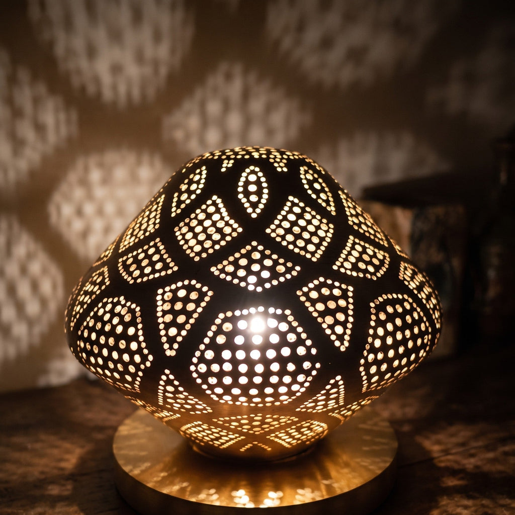 Close-up of the lit Louz dome, light through the pierced brass