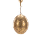 Massa pendant, an open punched brass egg, on a white studio background