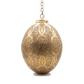 Merzouga brass lantern with hand-punched circles on a white studio background