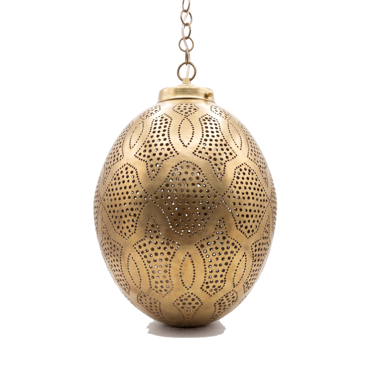 Merzouga brass lantern with hand-punched circles on a white studio background