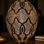 Detail of the lit Merzouga lantern, small circles of light through punched brass