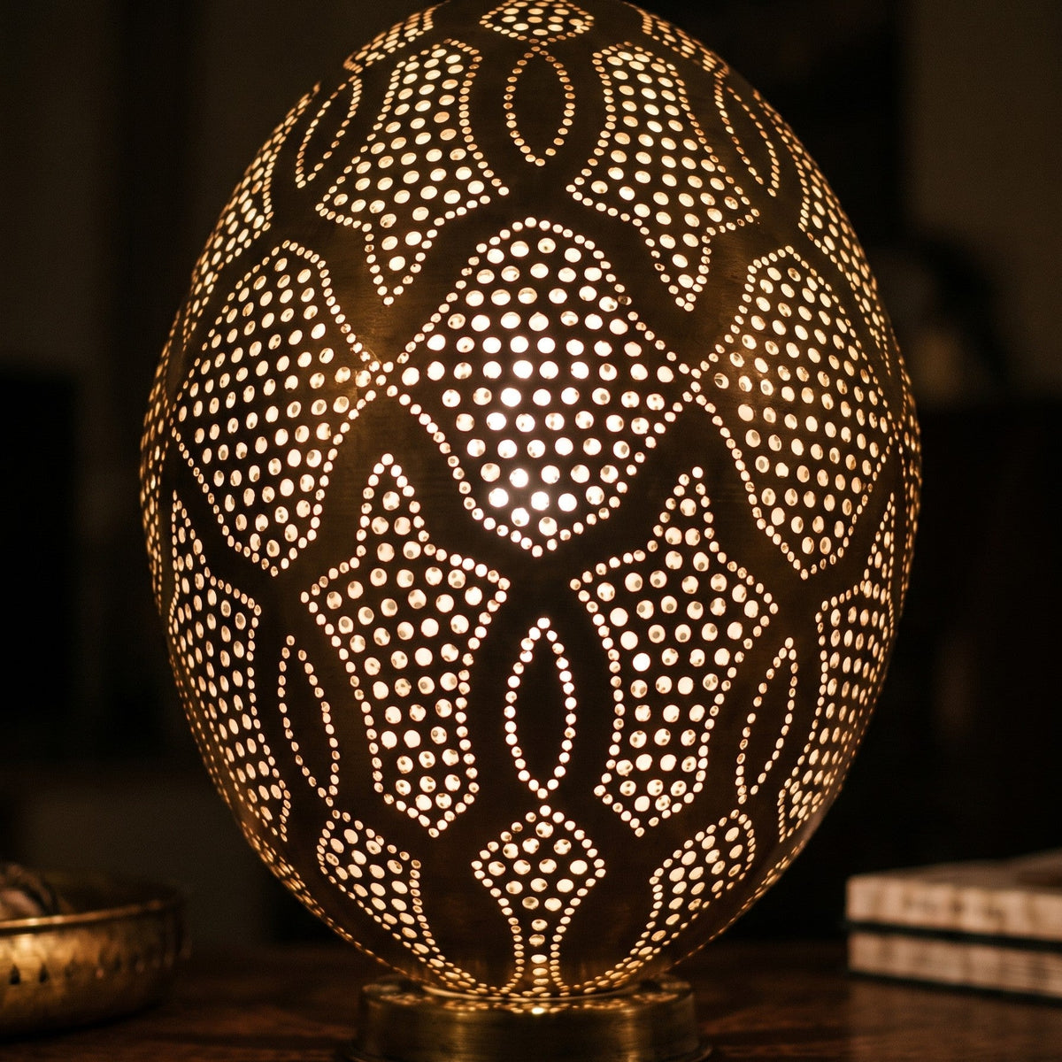 Detail of the lit Merzouga lantern, small circles of light through punched brass
