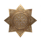Najma pierced brass wall sconce on a white studio background
