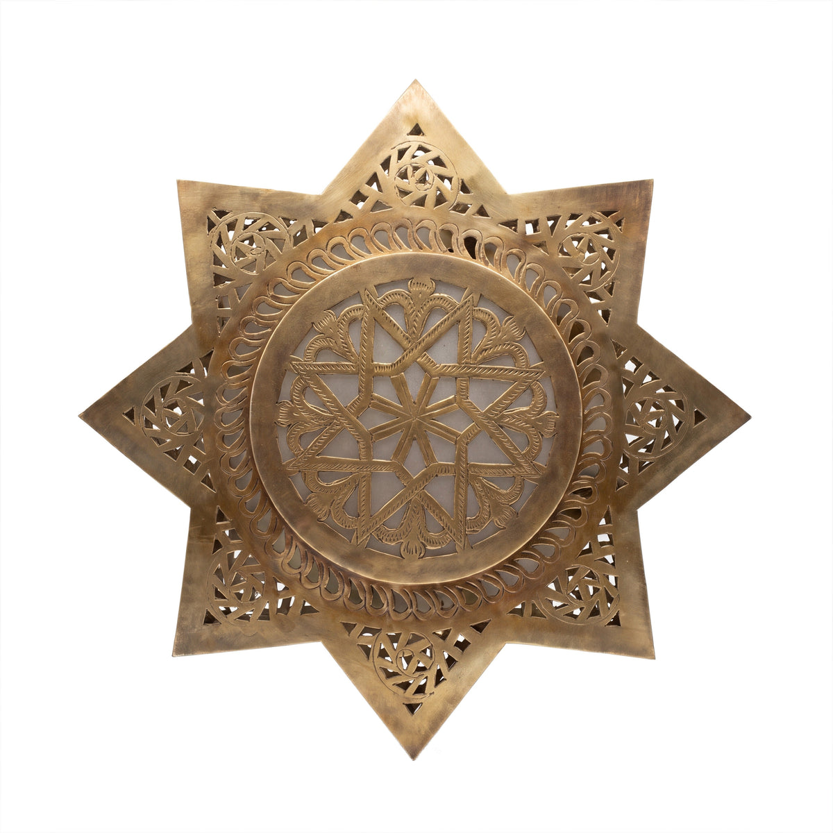Najma pierced brass wall sconce on a white studio background