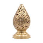 Naqsh brass table lamp pierced with Arabic calligraphy, on a white studio background