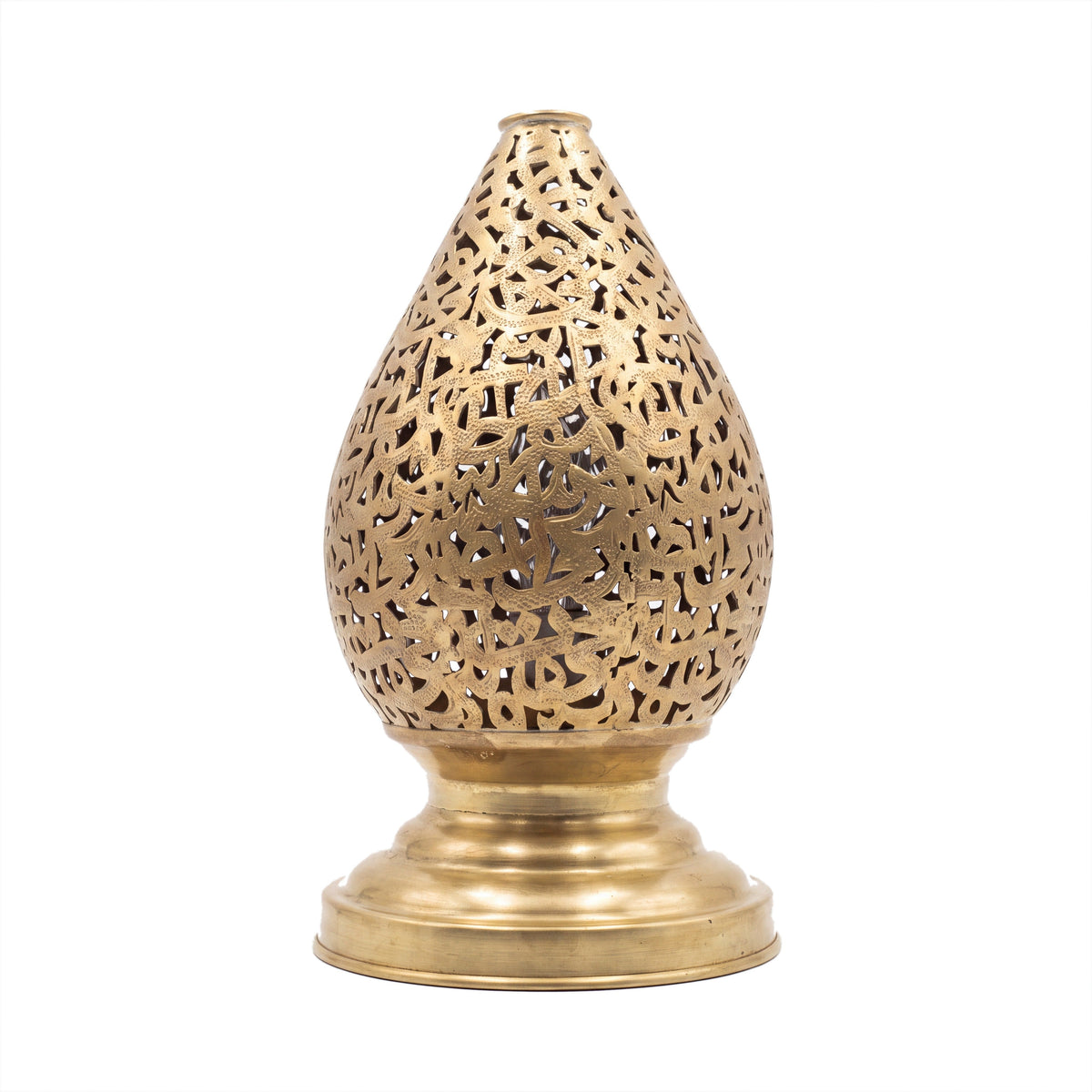 Naqsh brass table lamp pierced with Arabic calligraphy, on a white studio background