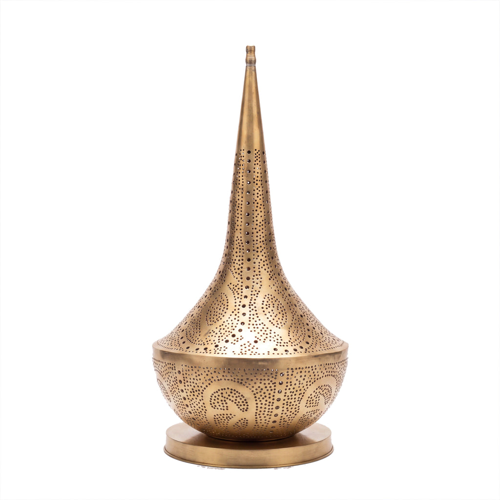 Nassim tall pierced brass table lamp photographed on a plain white studio background