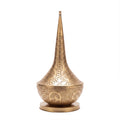 Nassim tall pierced brass table lamp photographed on a plain white studio background