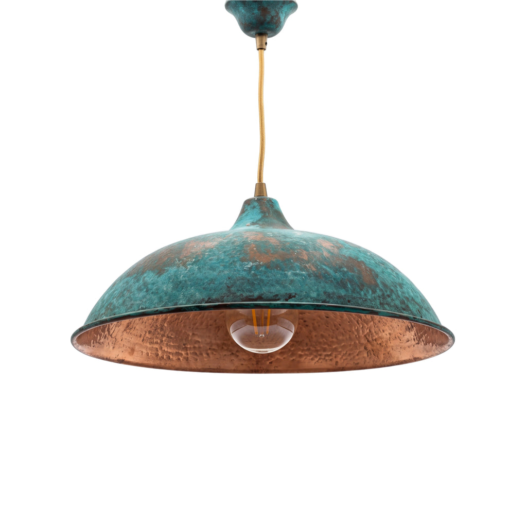 Nila oxidized copper pendant with green patina on a white studio background