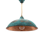 Nila oxidized copper pendant with green patina on a white studio background