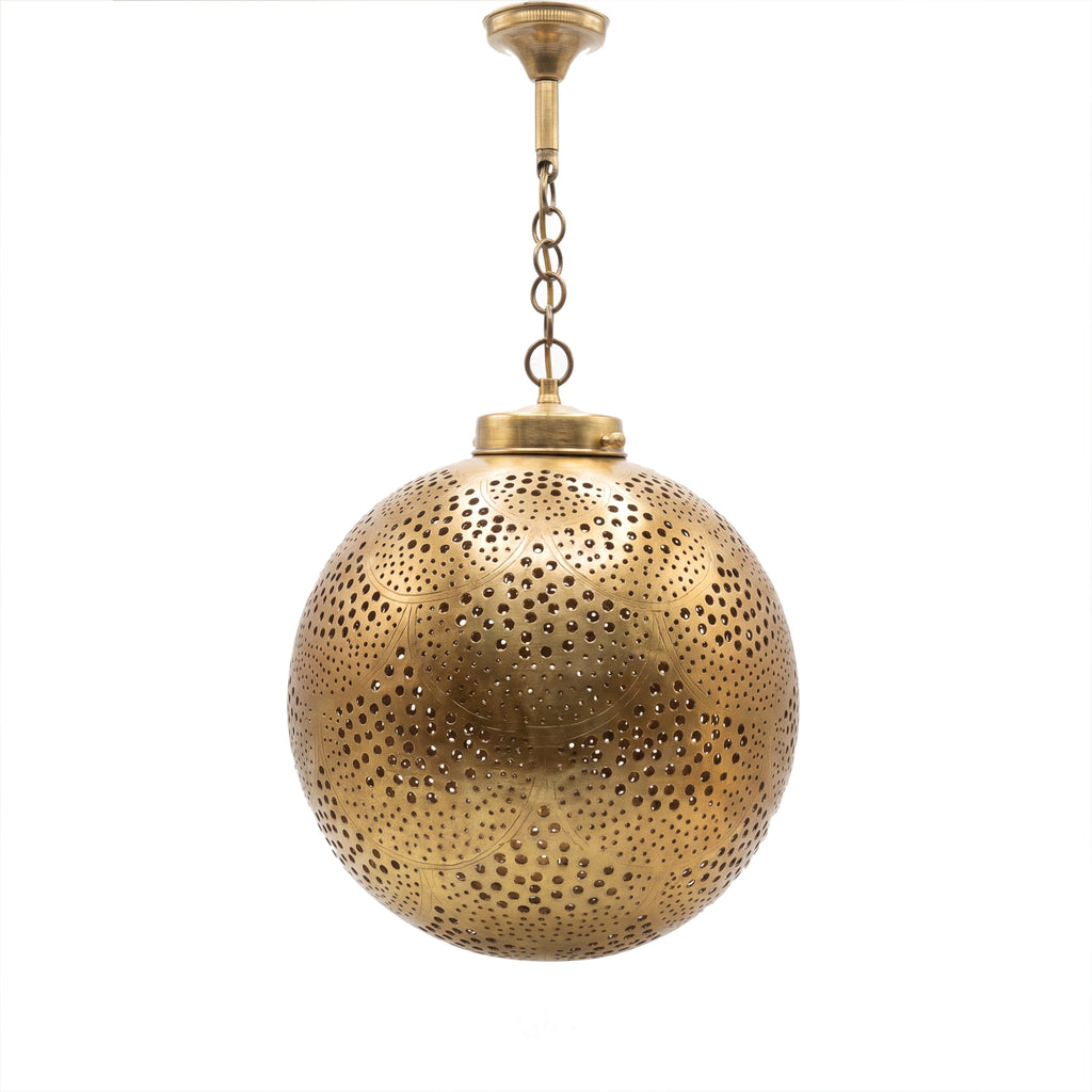 Qamar pendant, a pierced brass ball, on a white studio background