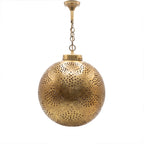 Qamar pendant, a pierced brass ball, on a white studio background