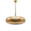 Saada pierced brass pendant on a white studio background