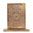 Sabah eclipse-shaped engraved brass table lamp on a white studio background