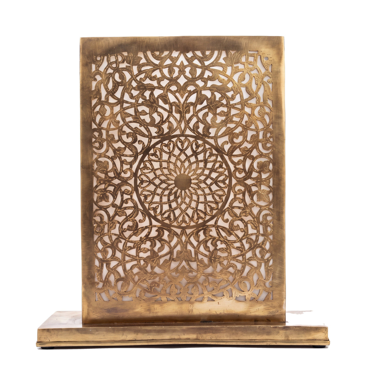 Sabah eclipse-shaped engraved brass table lamp on a white studio background