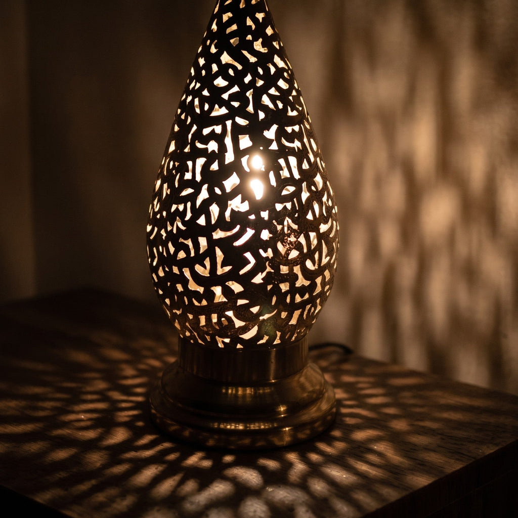 Close view of a lit Shama lantern, light passing through engraved calligraphy