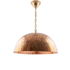Siniya hand-engraved copper dome pendant light on a white studio background