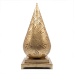 Siraj pierced brass table lantern on a white studio background